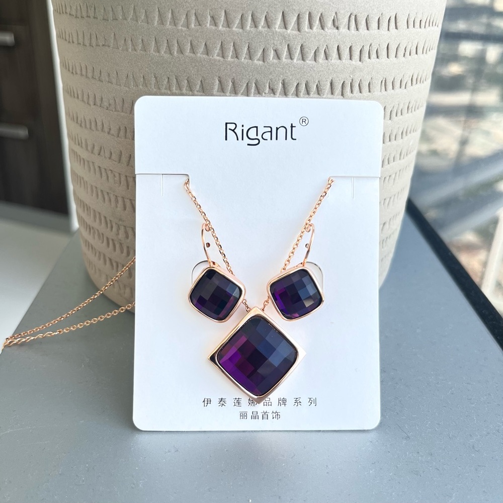 Gold necklace and earring set with purple rhinestone